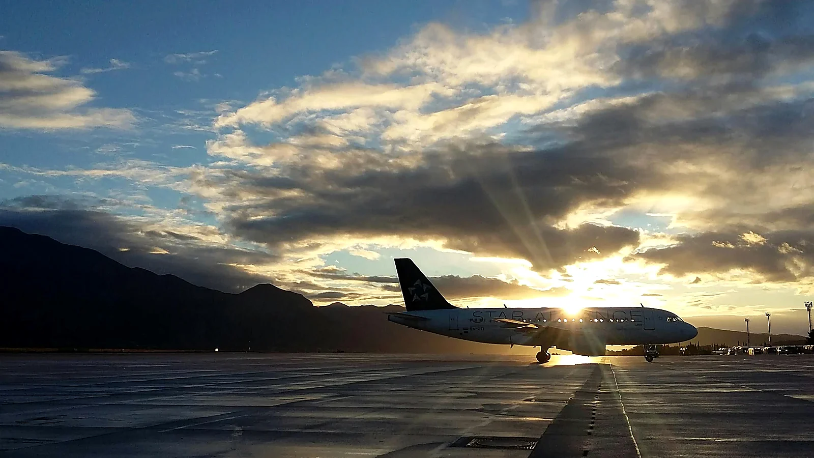 Passenger aircraft at sunset representing arrival in Nairobi